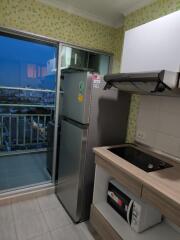 Modern kitchen with fridge and stovetop