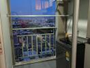 Small balcony with a city view at dusk