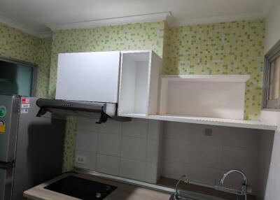 Modern kitchen with tiled backsplash and appliances