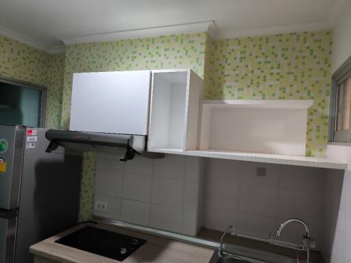 Modern kitchen with tiled backsplash and appliances