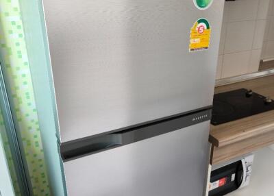 Kitchen with a Toshiba refrigerator and stove