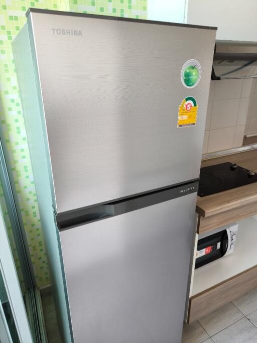 Kitchen with a Toshiba refrigerator and stove