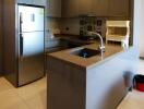 Modern kitchen with stainless steel appliances and sleek cabinetry