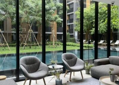 Modern living area with a pool view