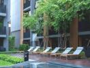 Outdoor area with pool and lounge chairs