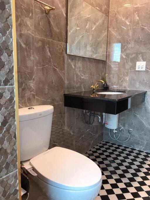 Modern bathroom with tiled walls and floor