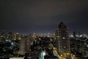 Night view of cityscape with tall buildings