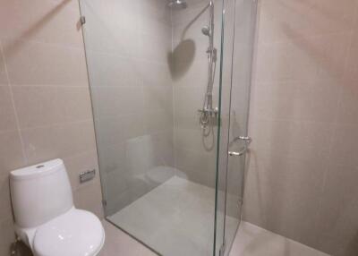 Modern bathroom with glass-enclosed shower