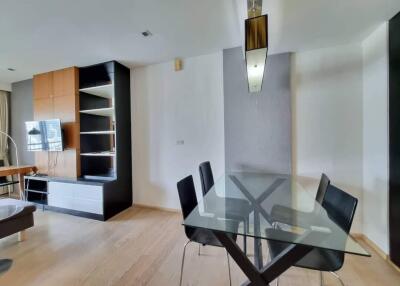 Contemporary dining room with glass table and modern decor