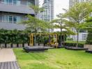 Modern apartment building with landscaped garden and seating area