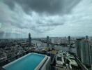 view from high-rise building with pool overlooking cityscape and river