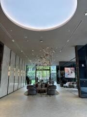 Luxury lobby area with modern furniture and grand chandelier