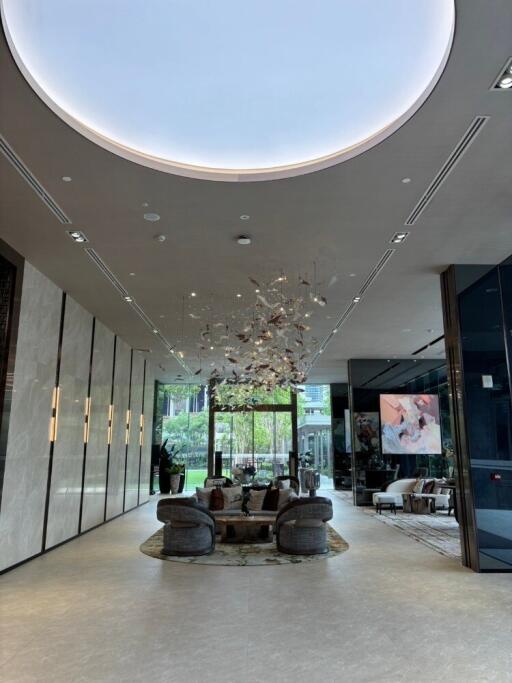 Luxury lobby area with modern furniture and grand chandelier