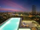 Rooftop infinity pool with city skyline view at dusk