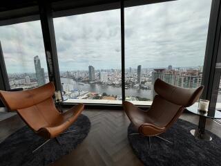 Modern living room with floor-to-ceiling windows and city view