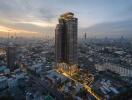 Aerial view of a tall building in a cityscape at dusk