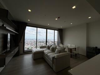 Modern living room with large windows and city view