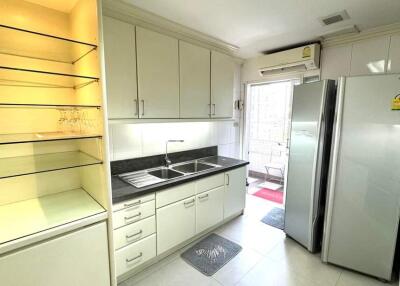 Modern kitchen with ample storage and stainless steel appliances