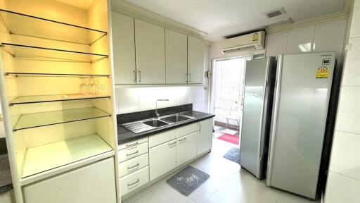 Modern kitchen with ample storage and stainless steel appliances