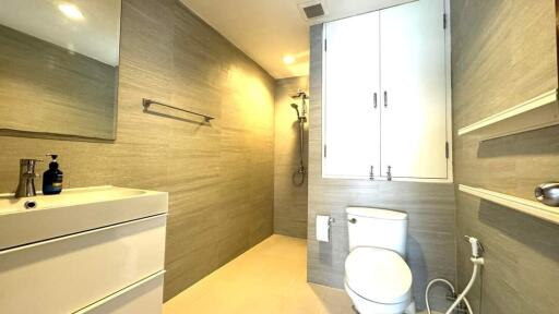 Modern bathroom with shower and white fixtures