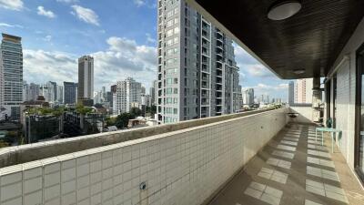 High-rise balcony with city skyline view