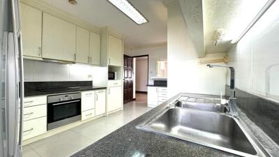 Modern kitchen with appliances and ample cabinetry