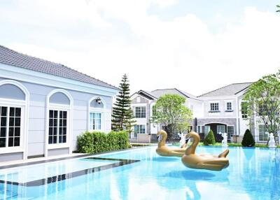 Luxury residential area with swimming pool and inflatable swan floats