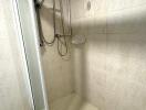 Shower area in bathroom with water heater