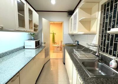 modern kitchen with integrated cabinets and granite countertops