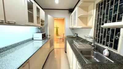 modern kitchen with integrated cabinets and granite countertops