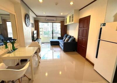 Spacious living room with modern furniture and balcony view