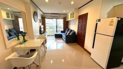 Spacious living room with modern furniture and balcony view