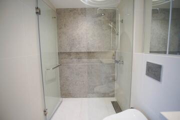 Modern bathroom with glass-enclosed shower