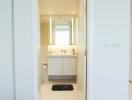 Modern white bathroom with mirror and vanity