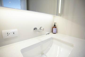 Modern bathroom sink with wall-mounted faucet