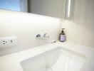 Modern bathroom sink with wall-mounted faucet