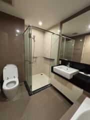 Modern bathroom with glass shower and sleek fixtures