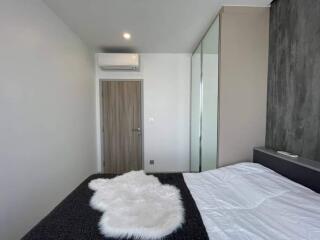 Modern bedroom with air conditioning and wardrobe