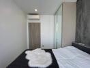 Modern bedroom with air conditioning and wardrobe