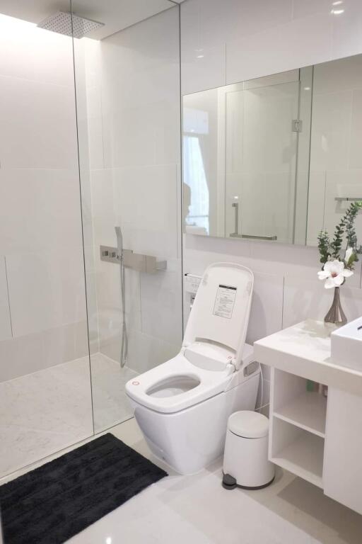 Modern bathroom with glass shower and toilet