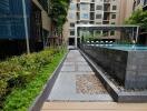 Garden area with a pathway leading to a swimming pool