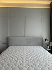 modern_well_lit_bedroom_with_mattress