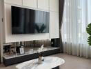 Modern living room with a wall-mounted TV and stylish decor