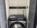 Compact laundry area with washer and shelf