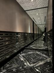 Modern corridor with decorative ceiling and marble floor