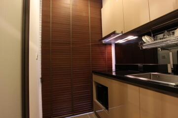 Modern kitchen with wooden blinds and built-in appliances