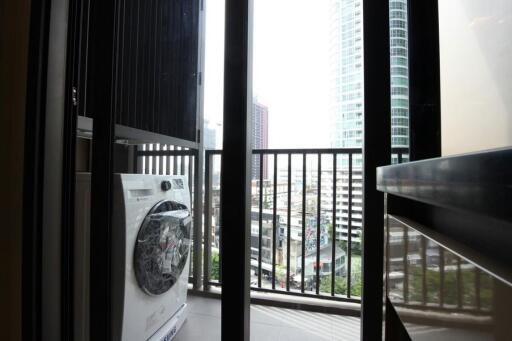 Balcony with washing machine and city view