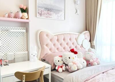 Bedroom with pink decor and plush toys