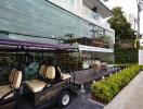 Exterior view of a modern building with a golf cart parked in front