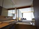 Modern bathroom with a view of the bedroom